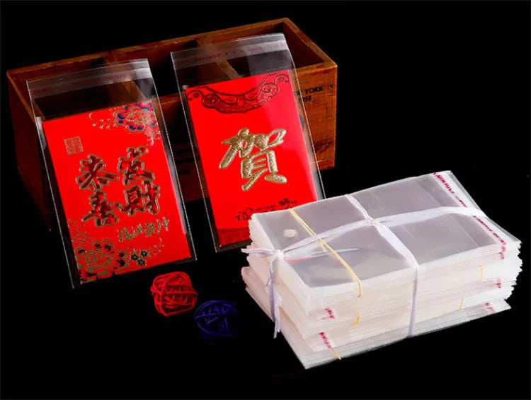 100PCS Sacos Adesivos Transparentes OPP de 20~55cm de Largura para Embalagem de Roupas, Calçados, Camisetas, Meias, Roupas Íntimas, Brinquedos, Livros e Presentes