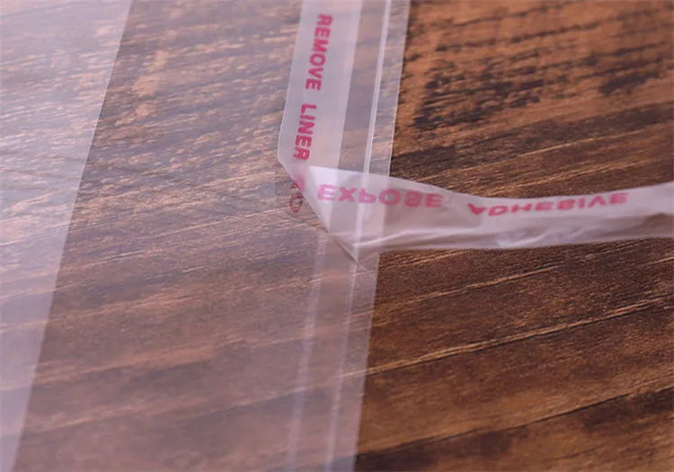 100PCS Sacos Adesivos Transparentes OPP de 20~55cm de Largura para Embalagem de Roupas, Calçados, Camisetas, Meias, Roupas Íntimas, Brinquedos, Livros e Presentes