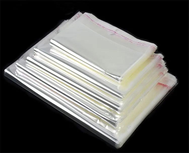 100PCS Sacos Adesivos Transparentes OPP de 20~55cm de Largura para Embalagem de Roupas, Calçados, Camisetas, Meias, Roupas Íntimas, Brinquedos, Livros e Presentes